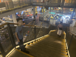 Miaomiao and Max at the staircase from the Third Floor to the Second Floor of the NEMO Science Museum, viewed from the Third Floor