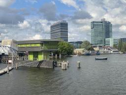 Boats on the Oosterdok canal, the Klimmuur wal, the Mövenpick Hotel Amsterdam City Centre and the UP Office Building, viewed from the Mr. J.J. van der Veldebrug bridge