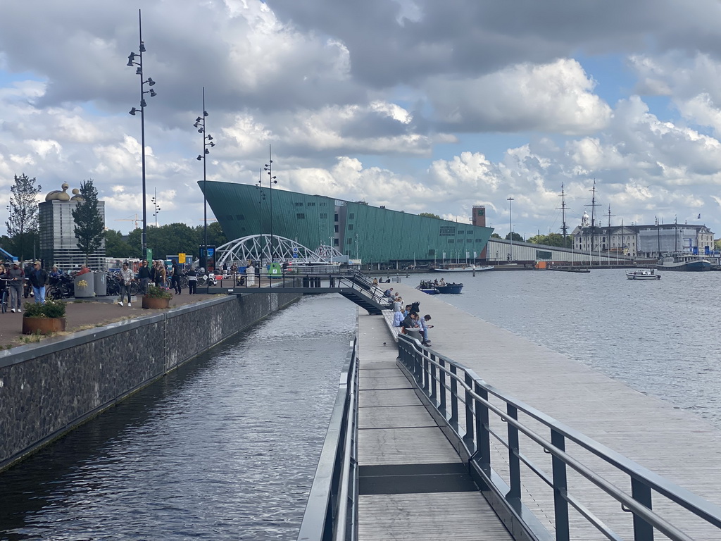 The pier at the Oosterdokskade street, the Mr. J.J. van der Veldebrug bridge over the Oosterdok canal and the the NEMO Science Museum