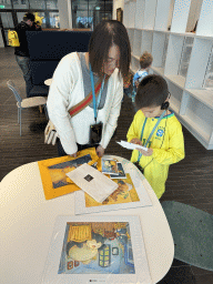 Miaomiao and Max with Pokémon items at the café at the ground floor of the Van Gogh Museum