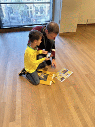 Tim and Max doing the Pokémon scavenger hunt at the second floor of the Van Gogh Museum