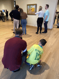 Tim and Max doing the Pokémon scavenger hunt in front of the painting `The Bedroom` by Vincent van Gogh at the second floor of the Van Gogh Museum