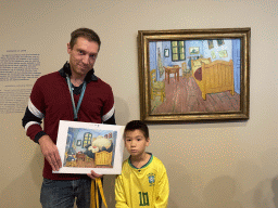 Tim and Max with the painting `The Bedroom` by Vincent van Gogh at the second floor of the Van Gogh Museum