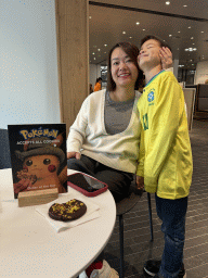 Miaomiao and Max having a cookie at the café at the ground floor of the Van Gogh Museum