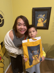 Miaomiao and Max with the painting `Pikachu inspired by Self-Portrait with Grey Felt Hat` by Naoyo Kimura at the `Pokémon at the Van Gogh Museum` exhibition at the second floor of the Van Gogh Museum