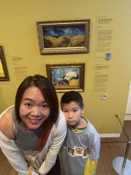 Miaomiao and Max with the paintings `Corviknight inspired by Wheatfield with Crows` by Naoyo Kimura and `Munchlax and Snorlax inspired by The Bedroom` by Sowsow at the `Pokémon at the Van Gogh Museum` exhibition at the second floor of the Van Gogh Museum, with explanation