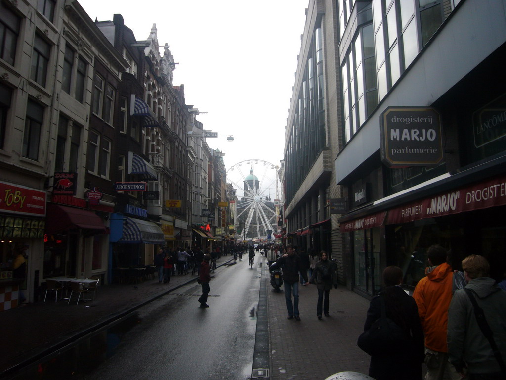 The Damstraat, with a Ferris Wheel and the Royal Palace Amsterdam