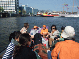 Rick, Jola, Irene, Mengjin and others on the tour boat at the De Ruyterkade pier at the IJ river