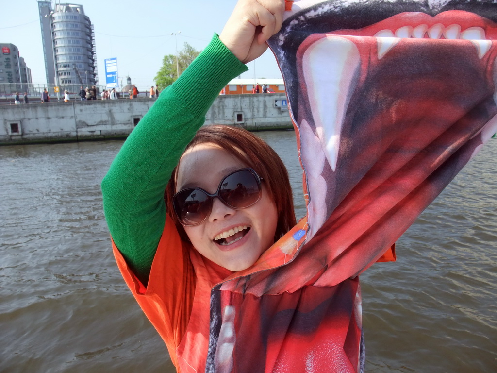 Miaomiao with orange lion shirt on the tour boat at the IJ river