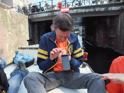 David on tour boat at the Korte Prinsengracht canal, with the Eenhoornsluis sluice