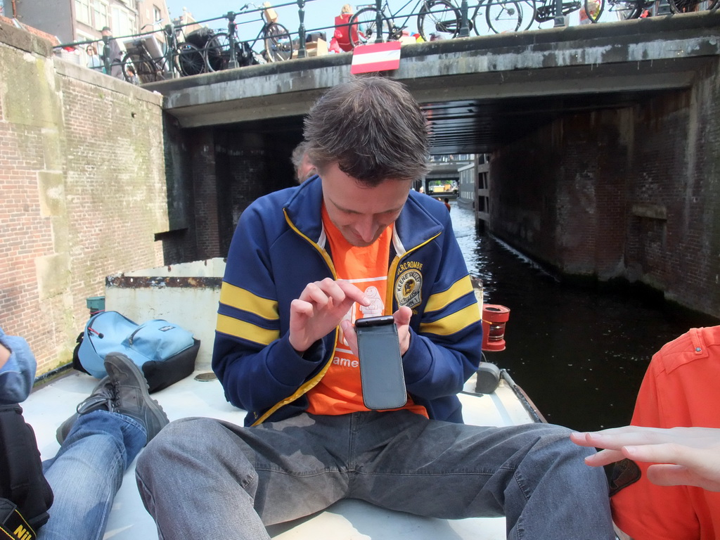 David on tour boat at the Korte Prinsengracht canal, with the Eenhoornsluis sluice