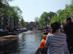 Irene and others on the tour boat at the Prinsengracht canal, with the bridge at the crossing of the Leidsegracht canal