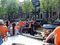 Houses and tour boat at the Prinsengracht canal