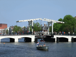 The Amstel river with the Magere Brug bridge, the Stopera and the Hermitage Amsterdam museum