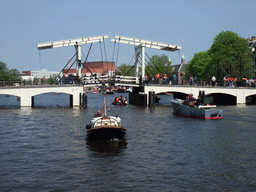 The Amstel river with the Magere Brug bridge, the Stopera, the Hermitage Amsterdam museum and the tower of the Zuiderkerk church