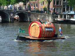 `Bierboeier` boat at the Amstel river, with the bridge at the crossing of the Herengracht canal