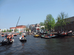 The Amstel river with the Blauwbrug bridge, the bridge at the crossing of the Nieuwe Herengracht canal, the Stopera and the Hermitage Amsterdam museum