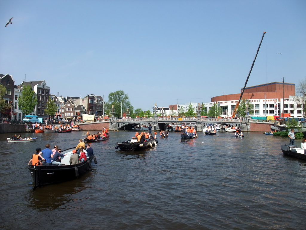 The Amstel river with the Blauwbrug bridge and the Stopera