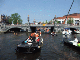 The Amstel river with the Blauwbrug bridge and the Stopera