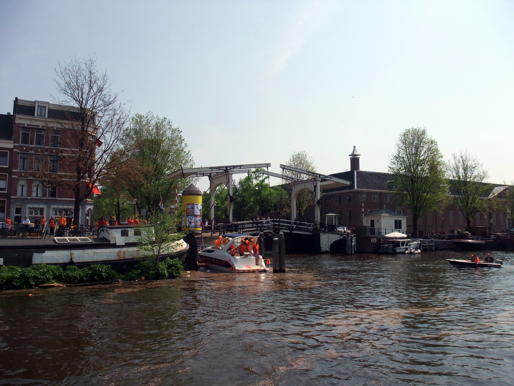 The Amstel river, the bridge at the crossing of the Nieuwe Herengracht canal and the Hermitage Amsterdam museum