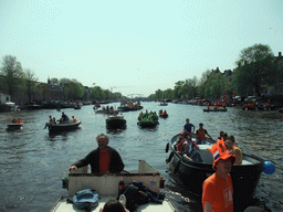 David and the skipper on the tour boat at the Amstel river, with the Magere Brug bridge