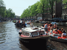 Boats at the Singel canal with the bridge at the crossing of the Wolvenstraat street