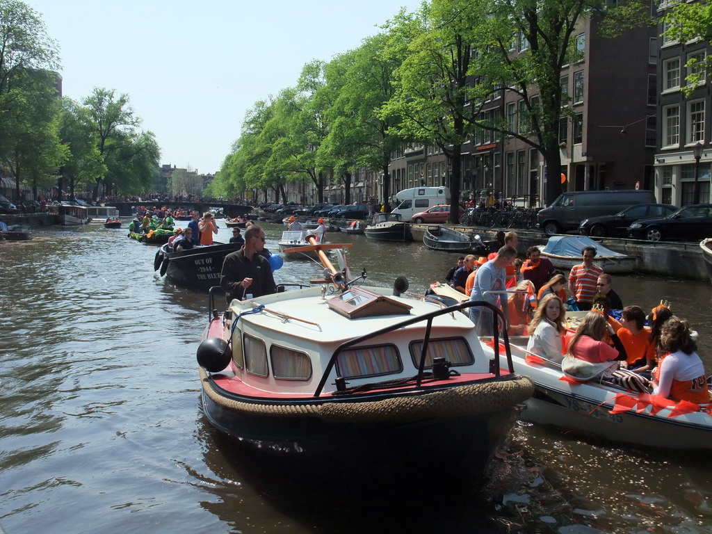 Boats at the Singel canal with the bridge at the crossing of the Wolvenstraat street