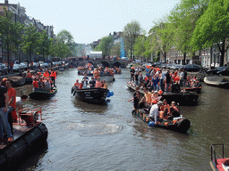 Tour boats at the Singel canal with the Torensluis bridge