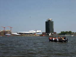 The tour boat at the IJ river with the Overhoeks Tower