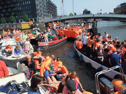 Anand, Susann and others on the tour boat at the Westerdok canal with the Han Lammersbrug bridge