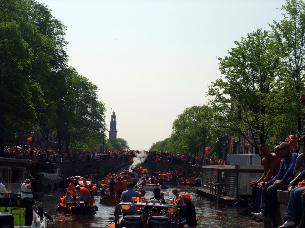 Tour boats at the Korte Prinsengracht canal, with the bridge at the crossing of the Brouwersgracht canal and the tower of the Westerkerk church