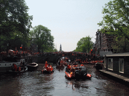 Tour boats at the Korte Prinsengracht canal, with the bridge at the crossing of the Brouwersgracht canal and the tower of the Westerkerk church