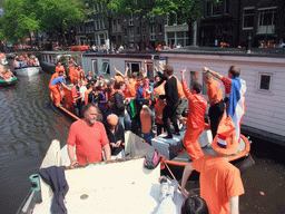 The skipper, David and others on the tour boat at the Prinsengracht canal