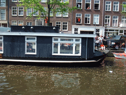 House boat with our reflection in its windows, at the Prinsengracht canal
