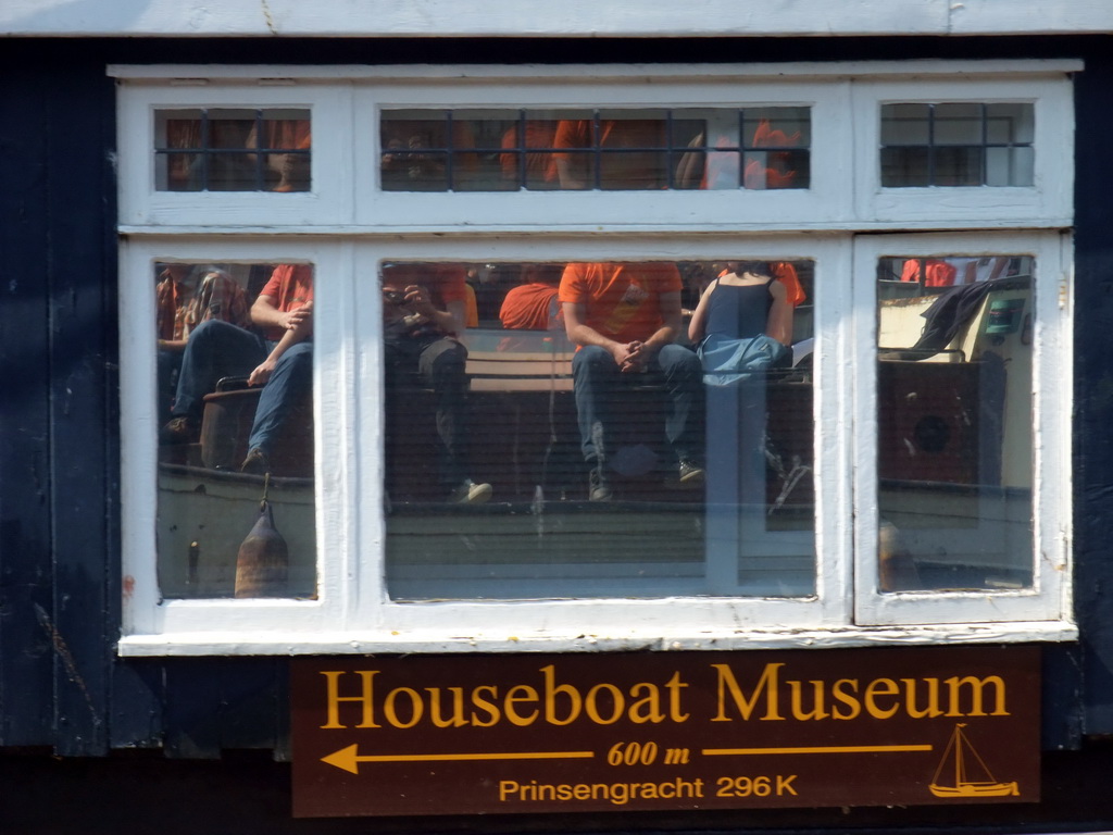 House boat with our reflection in its windows, at the Prinsengracht canal
