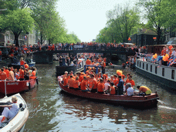 Tour boats at the Prinsengracht canal, with the bridge at the crossing of the Berenstraat street