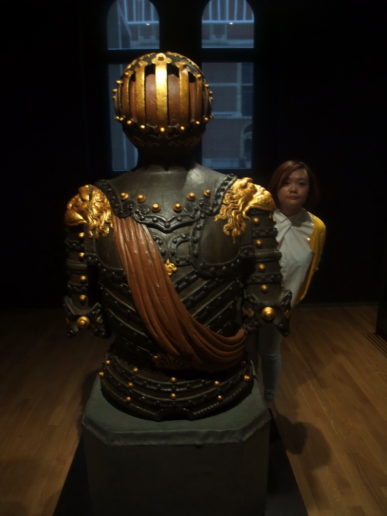 Miaomiao with an armour in the Ship Models room on the ground floor of the Rijksmuseum