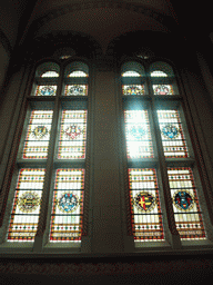 Stained glass windows in the staircase from the first to the second floor of the Rijksmuseum