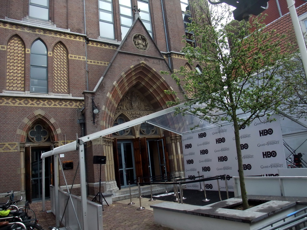 Front of the Posthoornkerk church at the Haarlemmerstraat street, with banners of `Game of Thrones: the Exhibition`