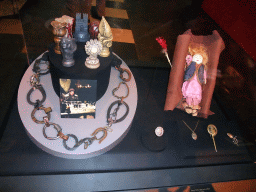 Statuettes of the Houses of Westeros, horseshoes, a photograph of Robb Stark, doll and pins at `Game of Thrones: the Exhibition` at the Posthoornkerk church