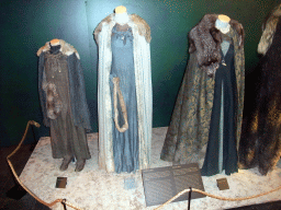 Costumes of Arya, Sansa and Catelyn Stark at `Game of Thrones: the Exhibition` at the Posthoornkerk church, with explanation