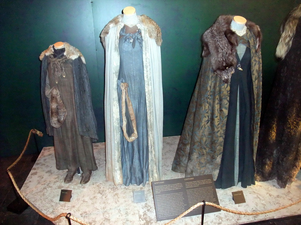 Costumes of Arya, Sansa and Catelyn Stark at `Game of Thrones: the Exhibition` at the Posthoornkerk church, with explanation