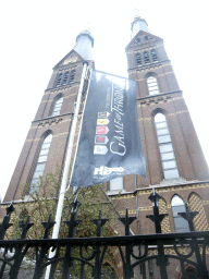 Front of the Posthoornkerk church at the Haarlemmerstraat street, with a banner of `Game of Thrones: the Exhibition`
