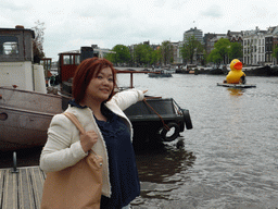 Miaomiao and boat with large plastic yellow duck on the Amstel river