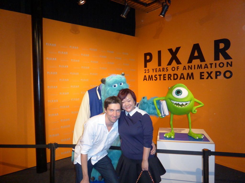 Tim and Miaomiao with characters from `Monsters Inc.` at the Pixar exhibition at the Amsterdam Expo building