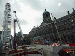 Ferris Wheel, other funfair attractions and the Royal Palace Amsterdam palace at the Dam square