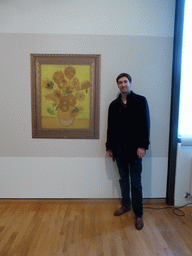 Tim with a poster of the temporarily removed painting `Sunflowers` by Vincent van Gogh at the Van Gogh Museum