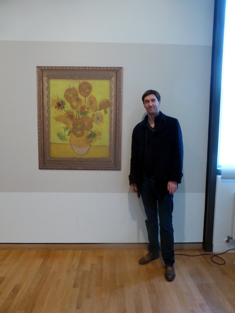 Tim with a poster of the temporarily removed painting `Sunflowers` by Vincent van Gogh at the Van Gogh Museum