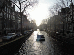 Boat in the Leidsegracht canal, viewed from a bridge at the Herengracht canal