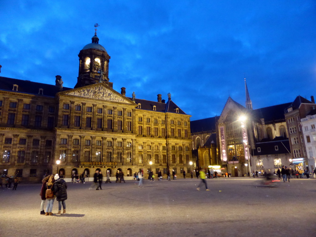 The Dam square with the Royal Palace Amsterdam and the Nieuwe Kerk church, by night